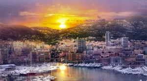 Yachts docked at a marina on the French Riviera at sunset