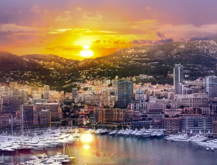Yachts docked at a marina on the French Riviera at sunset