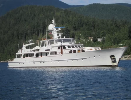 Luxury superyacht by land on a cloudy day