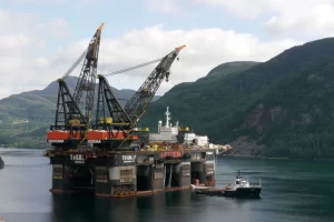 Offshore lift platform beside an island.